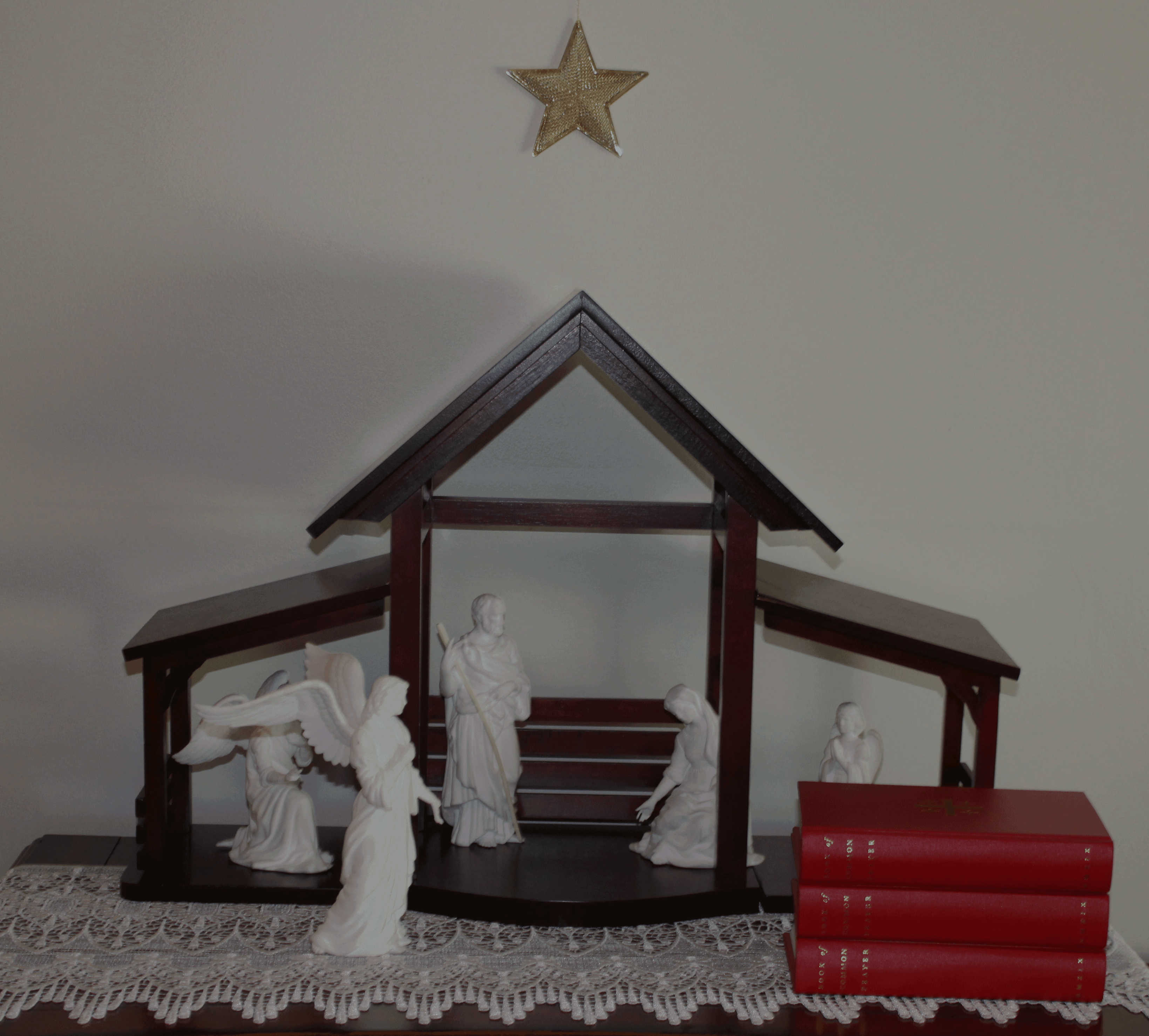 Nativity scene on table with Book of Common Prayer.